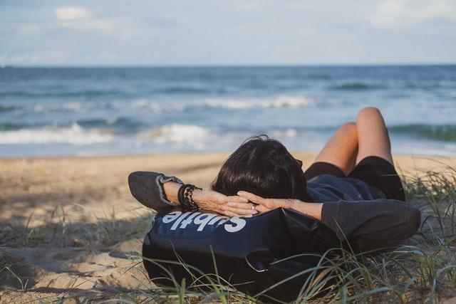 A picture shows a young man lying on the grass.